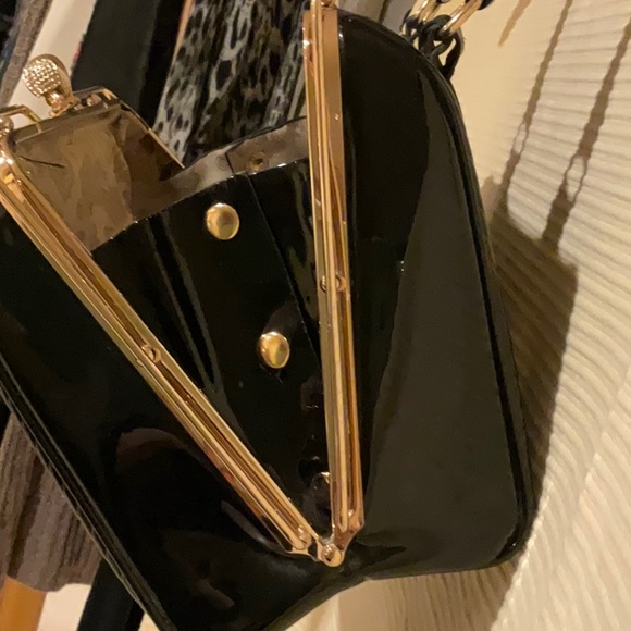 Patent leather black handbag with gold hardware and classic snap top closure - Picture 10 of 11